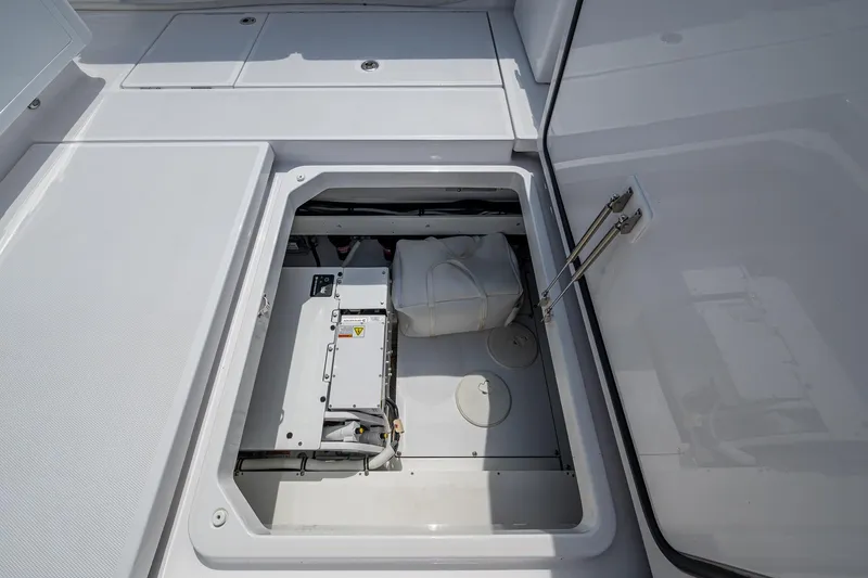  Yacht Photos Pics 2025 HCB 48 Campeon boat storage compartment with open hatch, showcasing interior equipment.