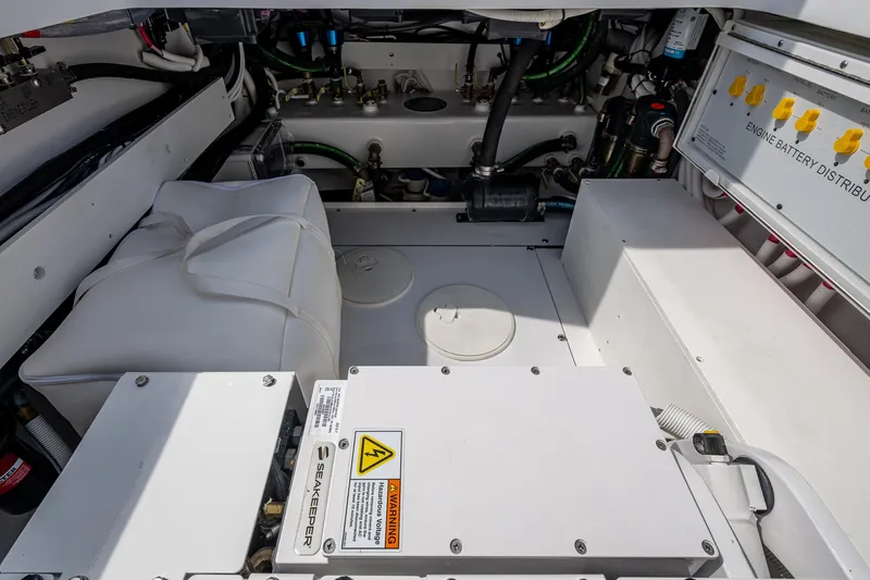  Yacht Photos Pics Engine compartment of 2025 HCB 48 Campeon boat, featuring electrical distribution panel and equipment.