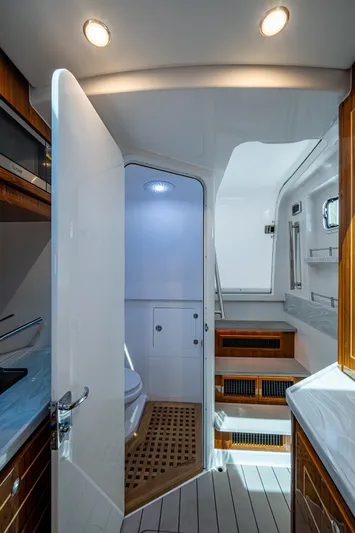  Yacht Photos Pics Interior of 2025 HCB 48 Campeon yacht, featuring modern bathroom and wooden accents.