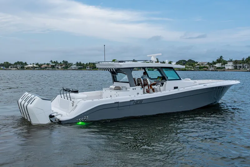  Yacht Photos Pics 2025 HCB 48 Campeon boat cruising on calm water, showcasing sleek design and powerful engines.