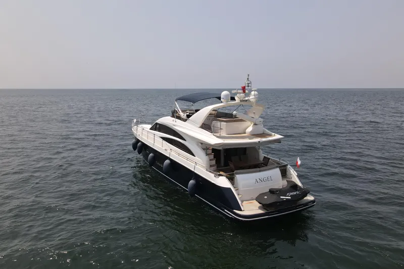  Yacht Photos Pics Luxurious 2008 Princess 67 Flybridge yacht cruising on open sea.