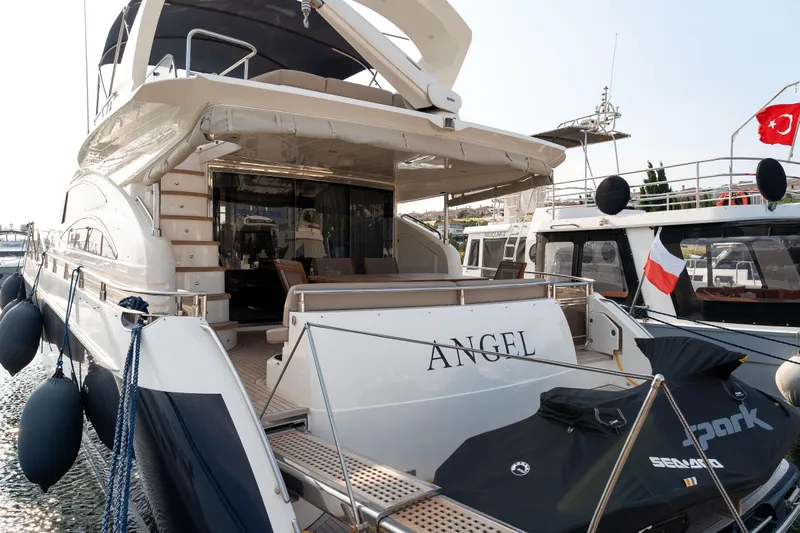  Yacht Photos Pics 2008 Princess 67 Flybridge yacht docked, featuring spacious deck and elegant design.