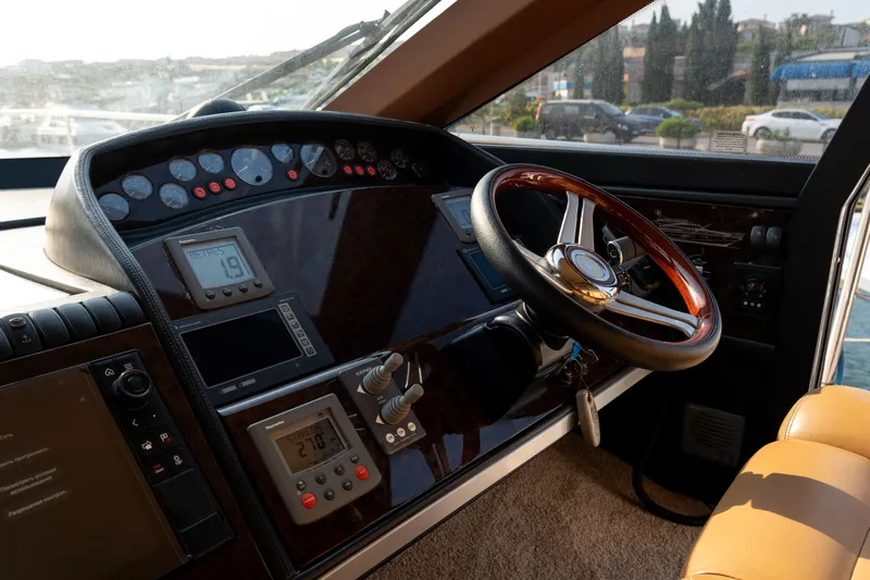  Yacht Photos Pics Helm of 2008 Princess 67 Flybridge yacht with steering wheel and navigation instruments.