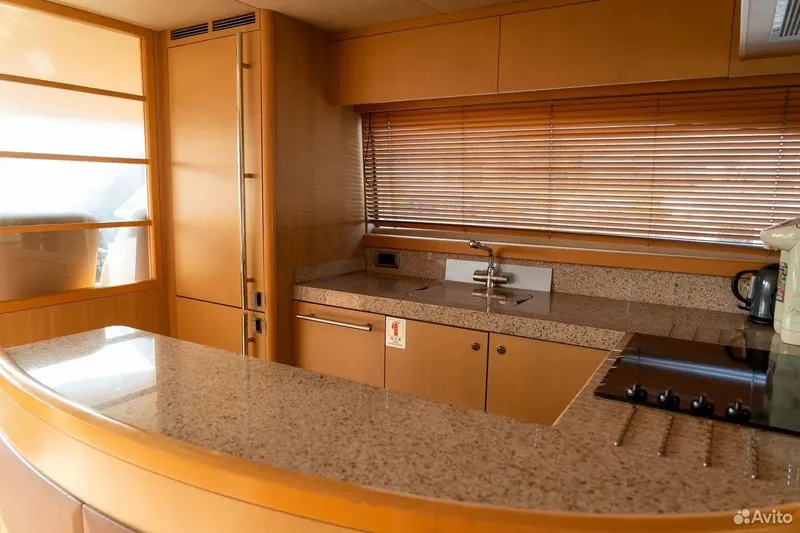  Yacht Photos Pics Luxurious kitchen interior of 2008 Princess 67 Flybridge yacht with modern amenities.