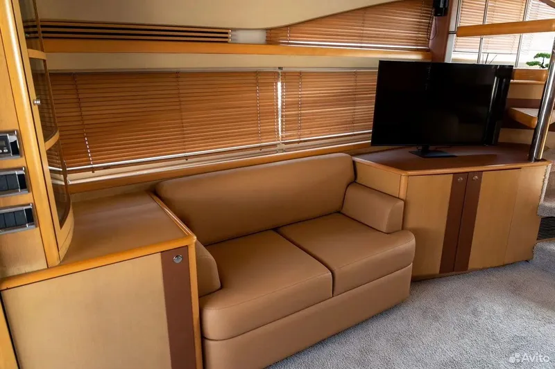  Yacht Photos Pics Luxurious interior of 2008 Princess 67 Flybridge yacht with sofa and TV.