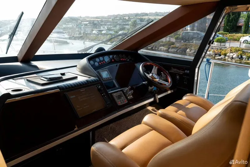  Yacht Photos Pics Interior view of 2008 Princess 67 Flybridge yacht helm with leather seating.