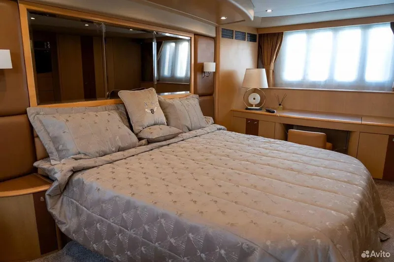  Yacht Photos Pics Luxurious bedroom interior on 2008 Princess 67 Flybridge yacht, featuring elegant bedding and modern decor.
