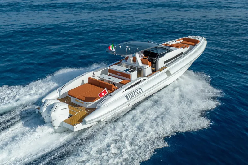  Yacht Photos Pics 2026 Pirelli 50 luxury yacht cruising on open sea, showcasing sleek design and powerful engines.