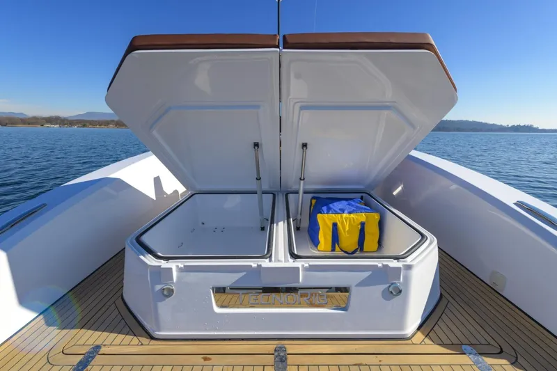  Yacht Photos Pics Open storage compartment on Pirelli 50 boat, featuring a blue and yellow bag, 2026 model.
