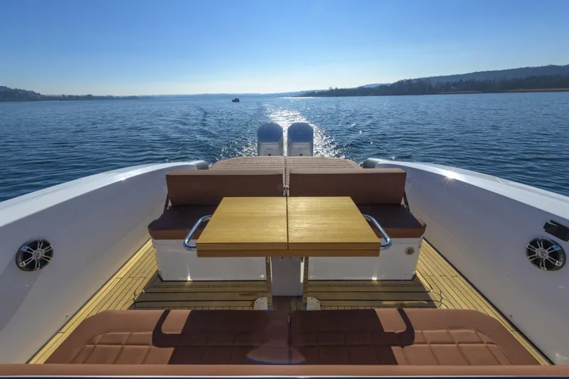  Yacht Photos Pics Luxury Pirelli 50 yacht interior, 2026 model, cruising on a serene blue lake.
