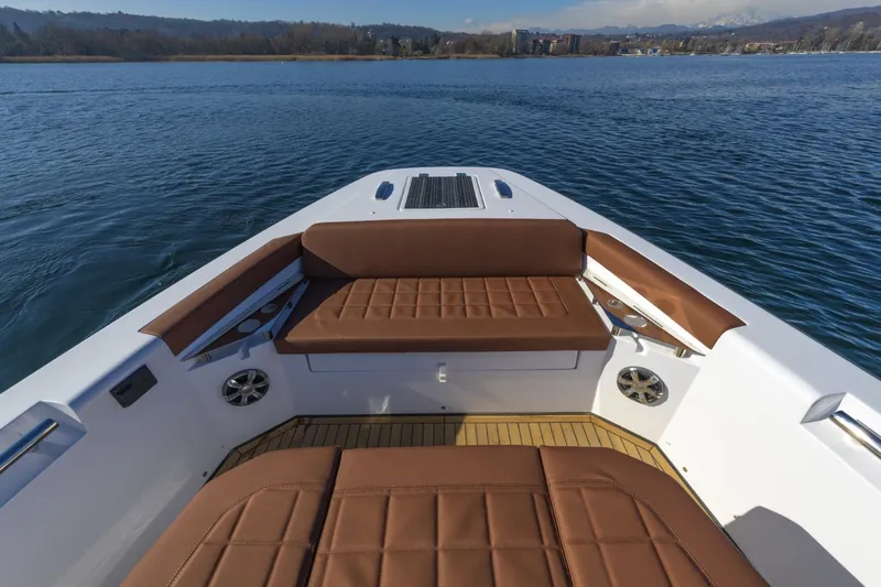  Yacht Photos Pics Luxury seating on a 2026 Pirelli 50 boat, overlooking serene waters.