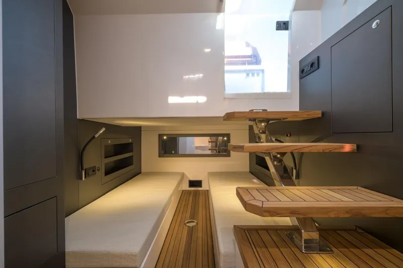  Yacht Photos Pics Modern interior of 2026 Pirelli 50 yacht with sleek design and wooden accents.