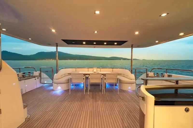 Blue Moon Yacht Photos Pics Luxurious 2013 Princess M Class 32M yacht deck with elegant seating and ocean view.