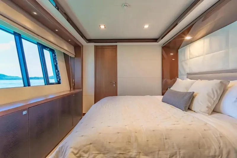 Blue Moon Yacht Photos Pics Luxurious bedroom interior on 2013 Princess M Class 32M yacht with ocean view.