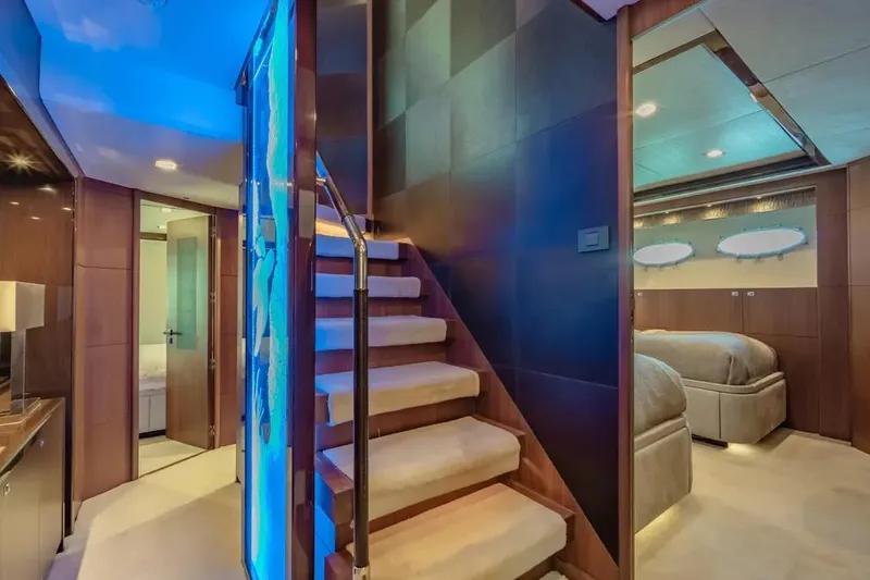 Blue Moon Yacht Photos Pics Luxurious interior of 2013 Princess M Class 32M yacht with elegant staircase and modern design.