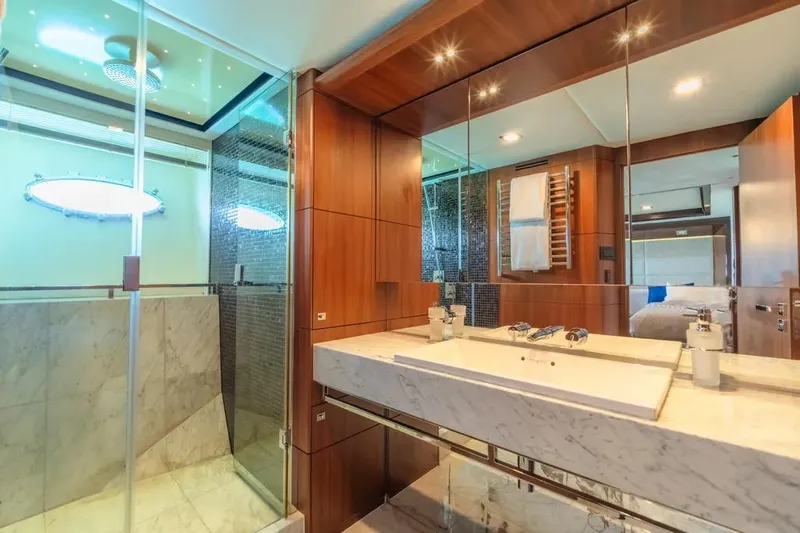 Blue Moon Yacht Photos Pics Luxurious bathroom in 2013 Princess M Class 32M yacht with marble sink and glass shower.