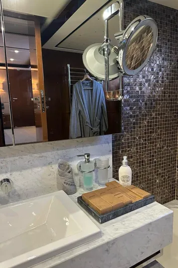 Blue Moon Yacht Photos Pics Luxurious bathroom in 2013 Princess M Class 32M yacht with elegant fixtures and marble countertop.