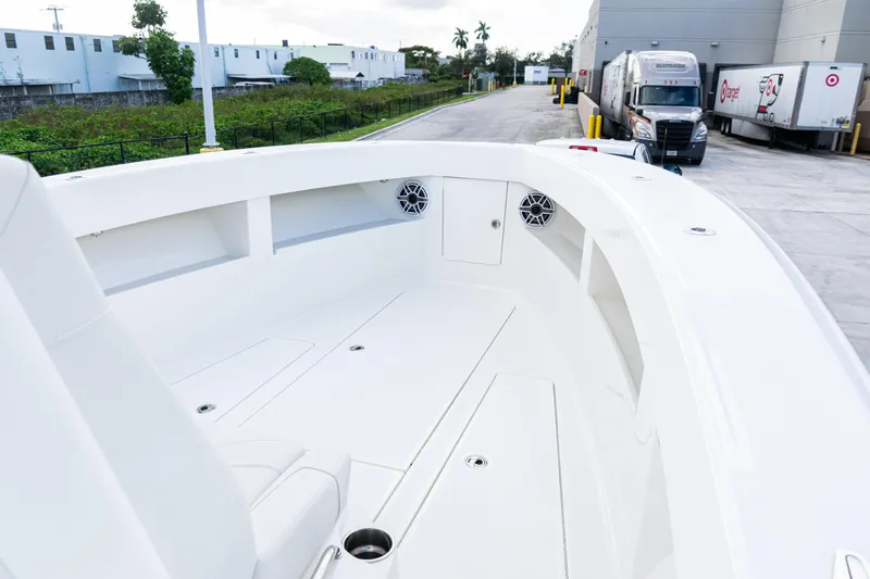  Yacht Photos Pics 2021 SeaVee 322Z boat interior with sleek white design and spacious seating area.