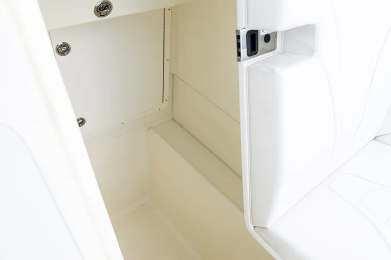  Yacht Photos Pics 2021 SeaVee 322Z boat interior storage compartment with white cushioned seating.