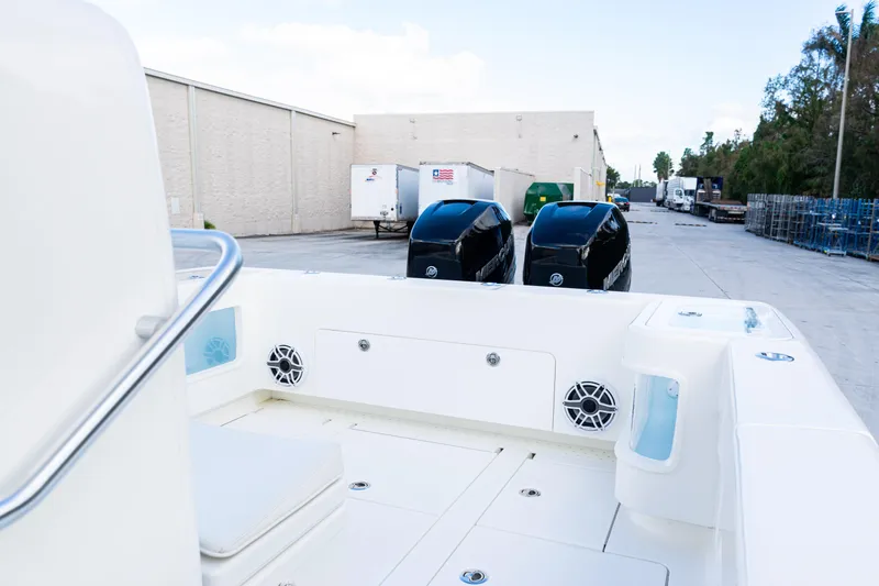  Yacht Photos Pics 2021 SeaVee 322Z boat with dual outboard engines in a warehouse setting.