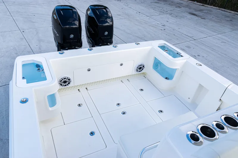  Yacht Photos Pics 2021 SeaVee 322Z boat deck with dual Mercury engines and storage compartments.