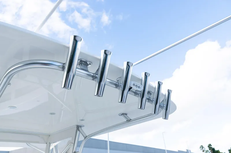  Yacht Photos Pics 2021 SeaVee 322Z boat with stainless steel rod holders against a blue sky.