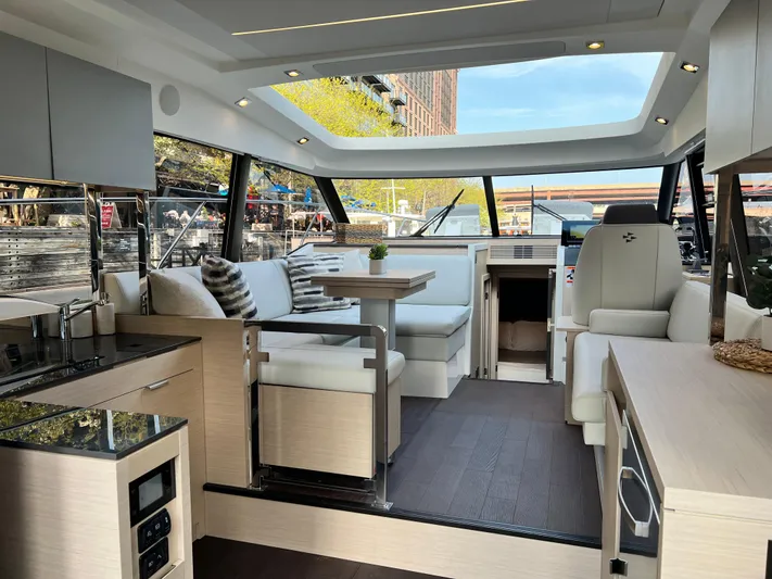  Yacht Photos Pics Luxurious interior of 2023 Prestige 420S yacht with modern seating and panoramic windows.