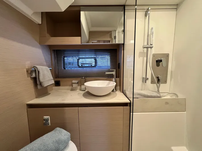  Yacht Photos Pics Modern bathroom in 2023 Prestige 420S yacht with sleek fixtures and elegant design.