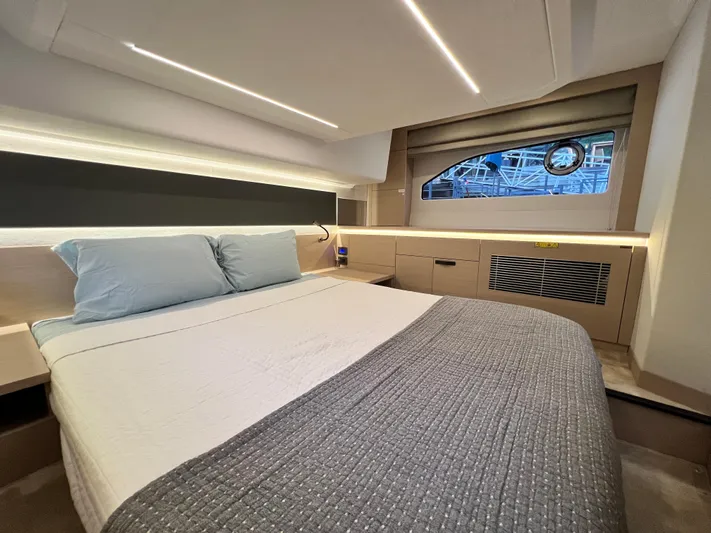  Yacht Photos Pics Luxurious bedroom interior of 2023 Prestige 420S yacht with modern design and elegant lighting.