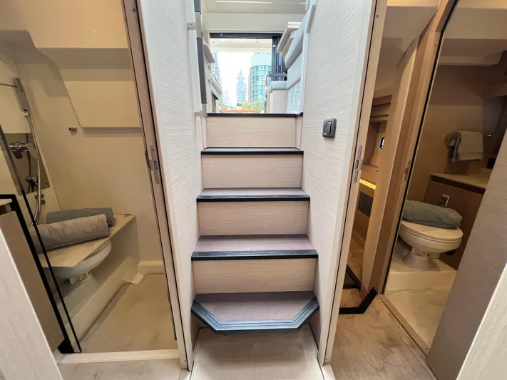  Yacht Photos Pics Interior of 2023 Prestige 420S yacht, featuring stairs and modern bathroom design.