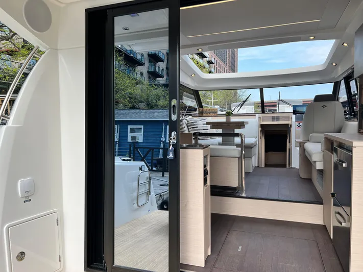  Yacht Photos Pics Luxurious interior of 2023 Prestige 420S yacht with modern seating and panoramic windows.