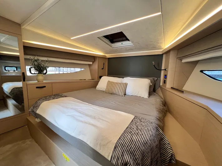 Yacht Photos Pics Luxurious bedroom interior of 2023 Prestige 420S yacht with modern design and ambient lighting.