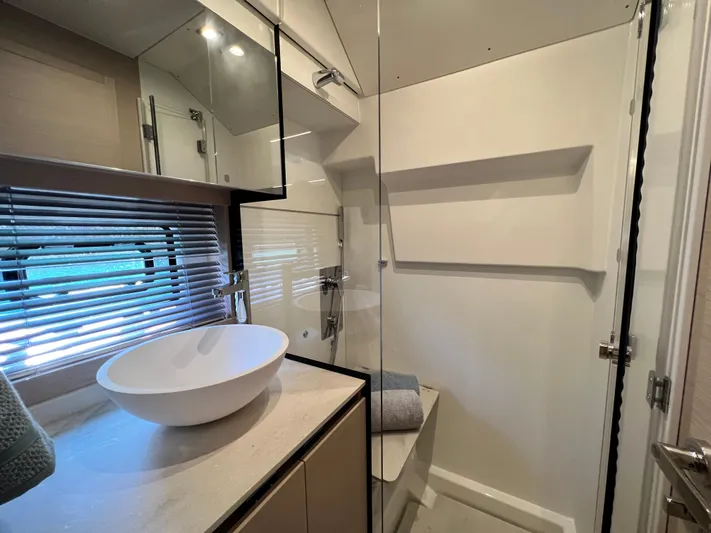  Yacht Photos Pics Modern bathroom in 2023 Prestige 420S yacht with sleek design and vessel sink.