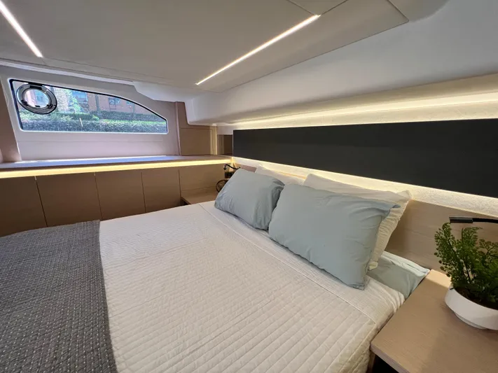  Yacht Photos Pics Luxurious bedroom interior of 2023 Prestige 420S yacht with modern design and natural lighting.