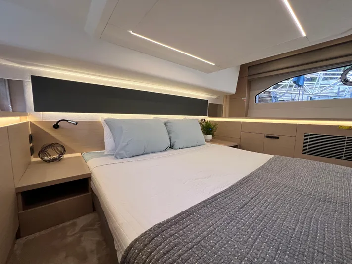  Yacht Photos Pics Luxurious cabin interior of 2023 Prestige 420S yacht with modern bedding and ambient lighting.