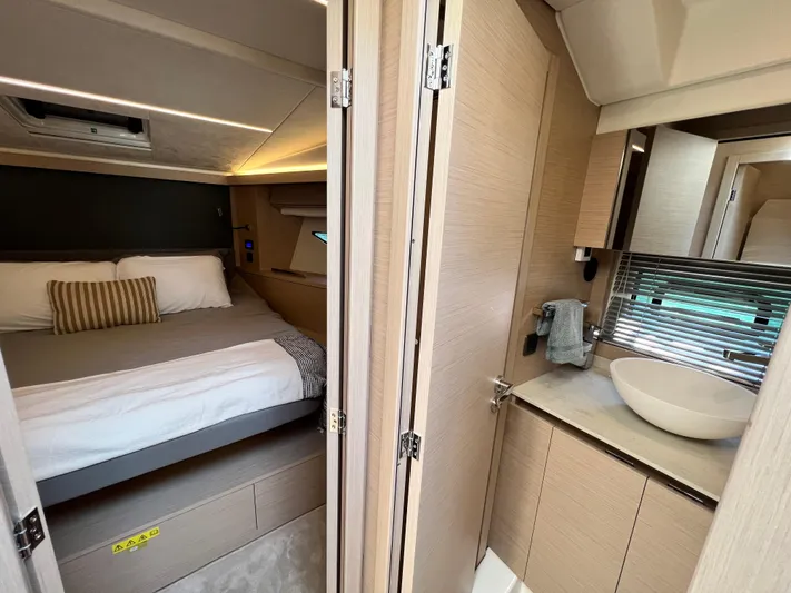  Yacht Photos Pics Luxurious 2023 Prestige 420S yacht interior with cozy bedroom and modern bathroom.