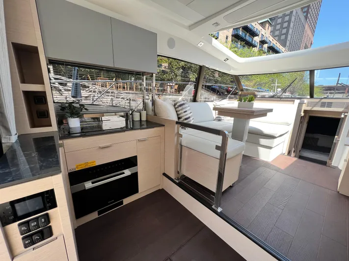  Yacht Photos Pics Luxurious interior of 2023 Prestige 420S yacht with modern kitchen and seating area.