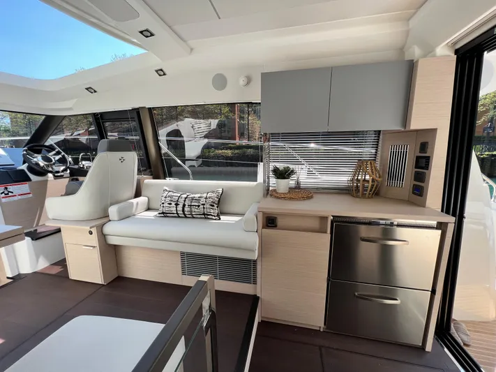  Yacht Photos Pics Luxurious interior of 2023 Prestige 420S yacht with modern seating and sleek cabinetry.