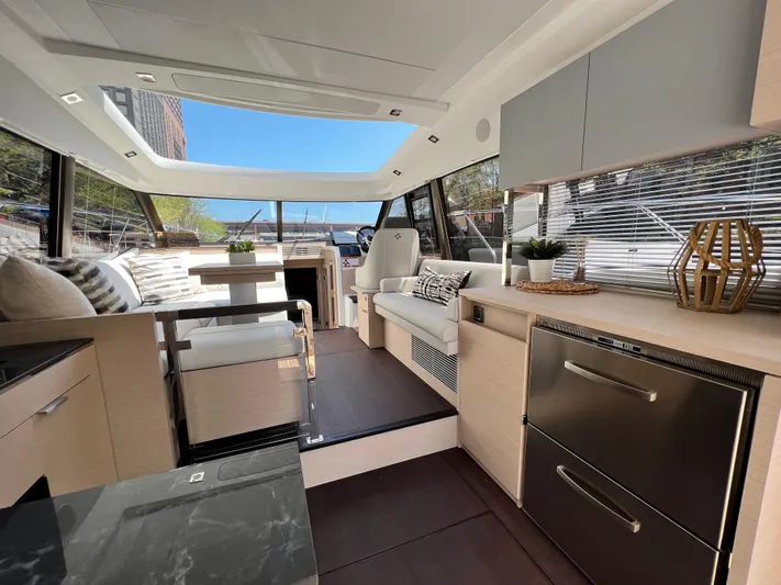  Yacht Photos Pics Luxurious interior of 2023 Prestige 420S yacht with modern furnishings and panoramic windows.