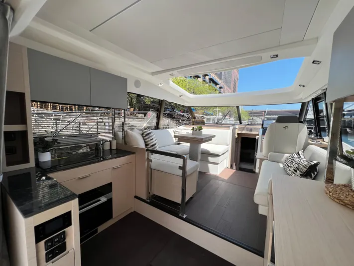  Yacht Photos Pics Luxurious interior of 2023 Prestige 420S yacht with modern kitchen and seating area.