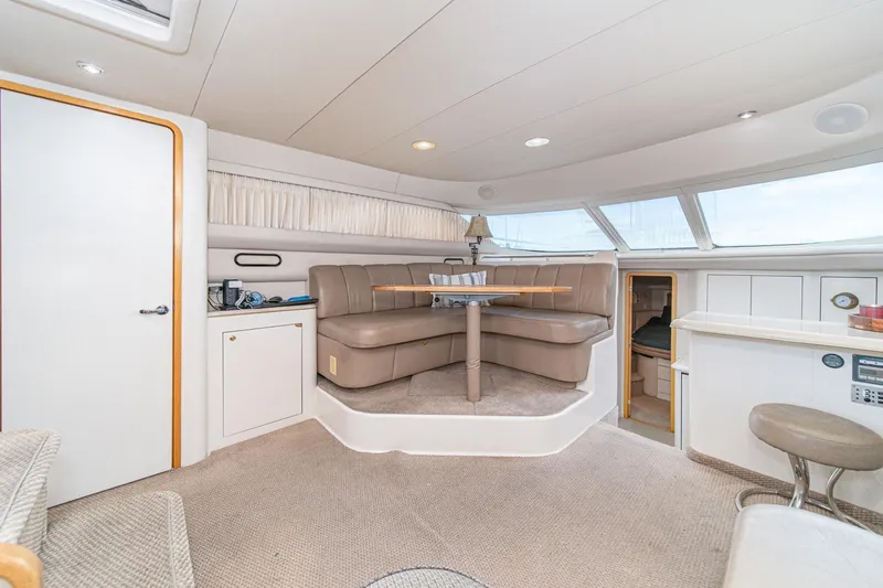 Free Spirit Yacht Photos Pics Luxurious interior of 1998 Sea Ray 420 Aft Cabin yacht with plush seating and elegant design.