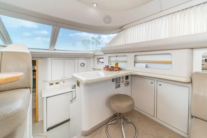 Free Spirit Yacht Photos Pics 1998 Sea Ray 420 Aft Cabin interior with modern kitchen and seating area.