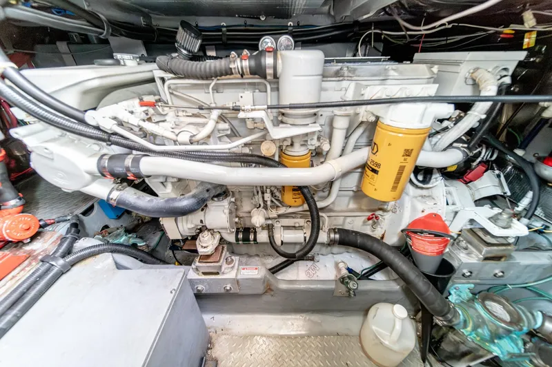 Free Spirit Yacht Photos Pics Engine room of a 1998 Sea Ray 420 Aft Cabin yacht, showcasing detailed machinery.