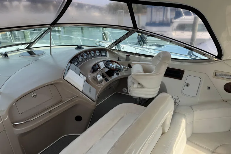 Go Girl Yacht Photos Pics 2001 Sea Ray 510 Sundancer helm with leather seating and modern controls.