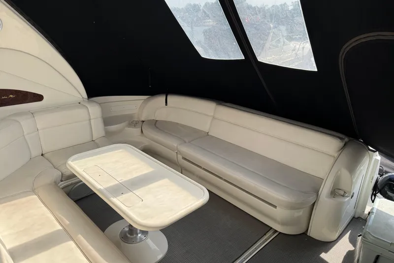 Go Girl Yacht Photos Pics Luxurious interior of 2001 Sea Ray 510 Sundancer yacht with white seating and table.