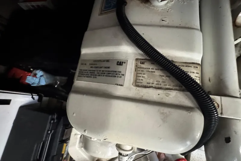 Go Girl Yacht Photos Pics Engine compartment of a 2001 Sea Ray 510 Sundancer with visible Caterpillar engine label.