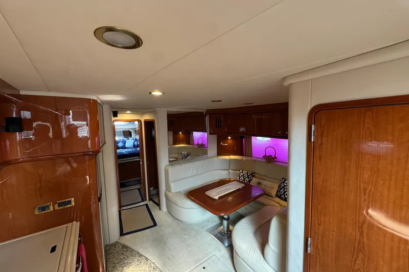 Go Girl Yacht Photos Pics Luxurious interior of 2001 Sea Ray 510 Sundancer yacht with elegant seating and wood finishes.