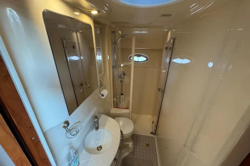 Go Girl Yacht Photos Pics Luxurious bathroom in 2001 Sea Ray 510 Sundancer yacht with modern fixtures and shower.