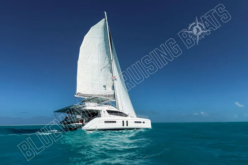 Sea Dog Yacht Photos Pics Sailing yacht Leopard 58, 2020 model, cruising on clear blue ocean waters.