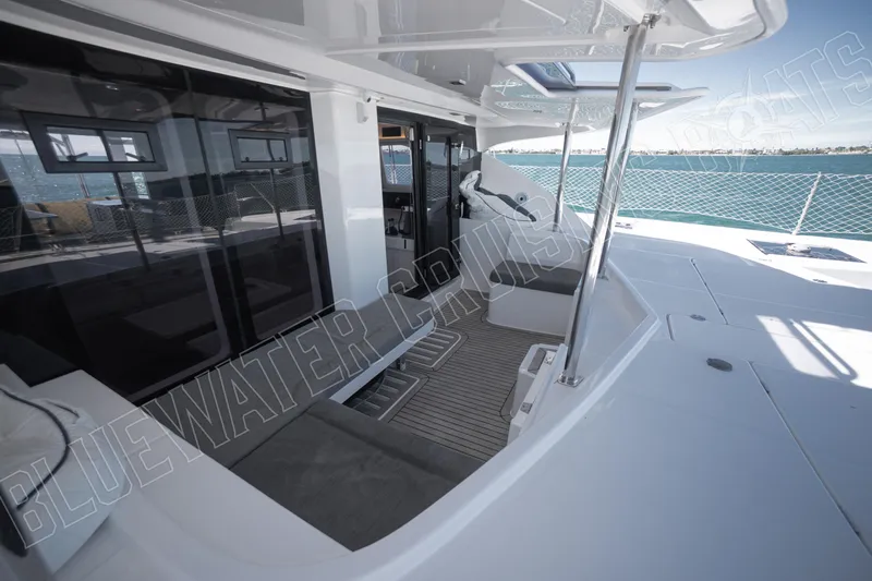 Sea Dog Yacht Photos Pics Luxurious 2020 Leopard 58 yacht deck with modern seating and ocean view.